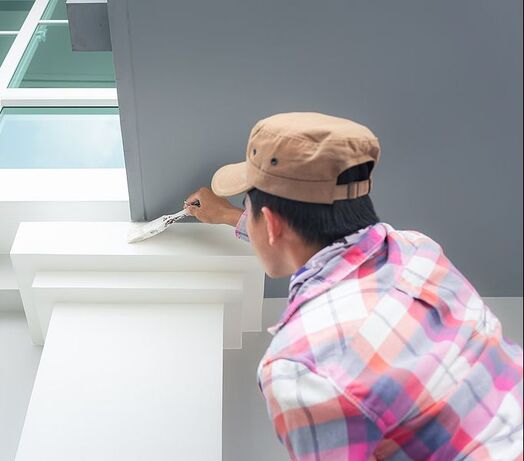 In Norwalk, CT, house painting work is done by a painter worker using bristles brushes.
